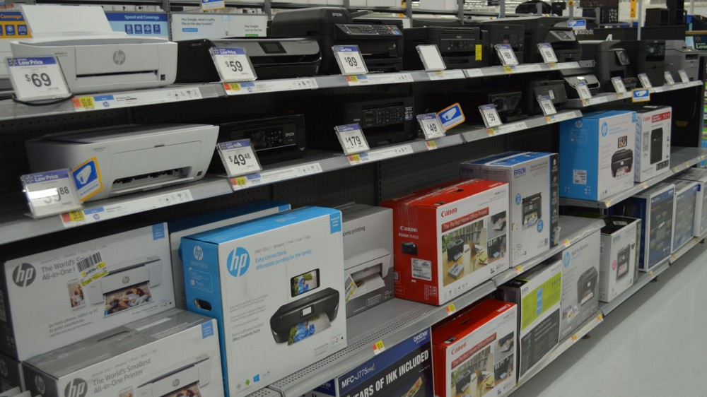 Lots of types of printers on store shelves.